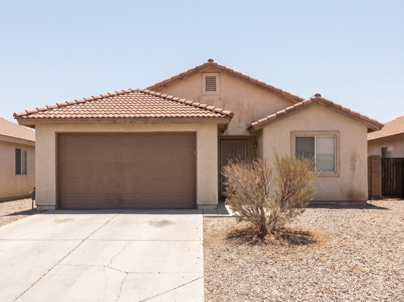A plain single-story Las Vegas home photographed as it stands in flat daylight